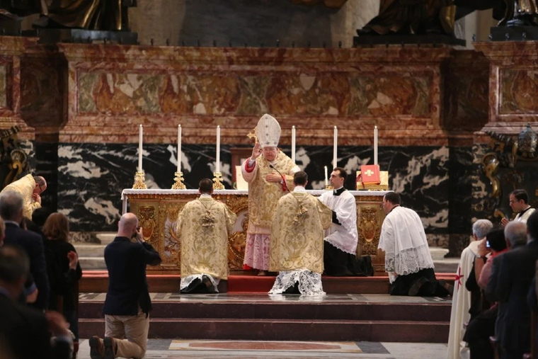 Cardinal Raymond Burke gives the final blessing after celebrating a Traditional Latin Mass at the Altar of the Chair in St. Peter’s Basilica during the third edition of the Summorum Pontificum pilgrimage in Rome on Oct. 25, 2014.