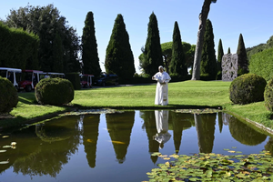 Pope Leo XIV feeds fish during the Sept. 5, 2025, inauguration of Borgo Laudato Si’, an ecological village on the papal estate of Castel Gandolfo, 18 miles south of Rome.