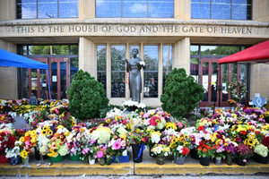 Flowers are seen on Sept. 3, 2025, outside Annunciation Catholic Church in Minneapolis, where a shooter killed two children and injured 21 other people on Aug. 27, 2025. 