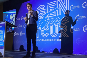 Charlie Kirk speaks on the stage during the Gen Free Tour. 