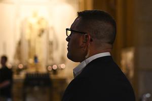 A security officer looks on during an Aug. 28 interfaith service at the Basilica of St. Mary following a mass shooting during an all-school Mass at Annunciation Catholic Church the previous morning in Minneapolis.