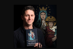 Author Gabriel Castillo holds his book, ‘The Power of the Rosary,’ with cover art by Chris Lewis, the illustrator behind Baritus Catholic Illustration, in the background.