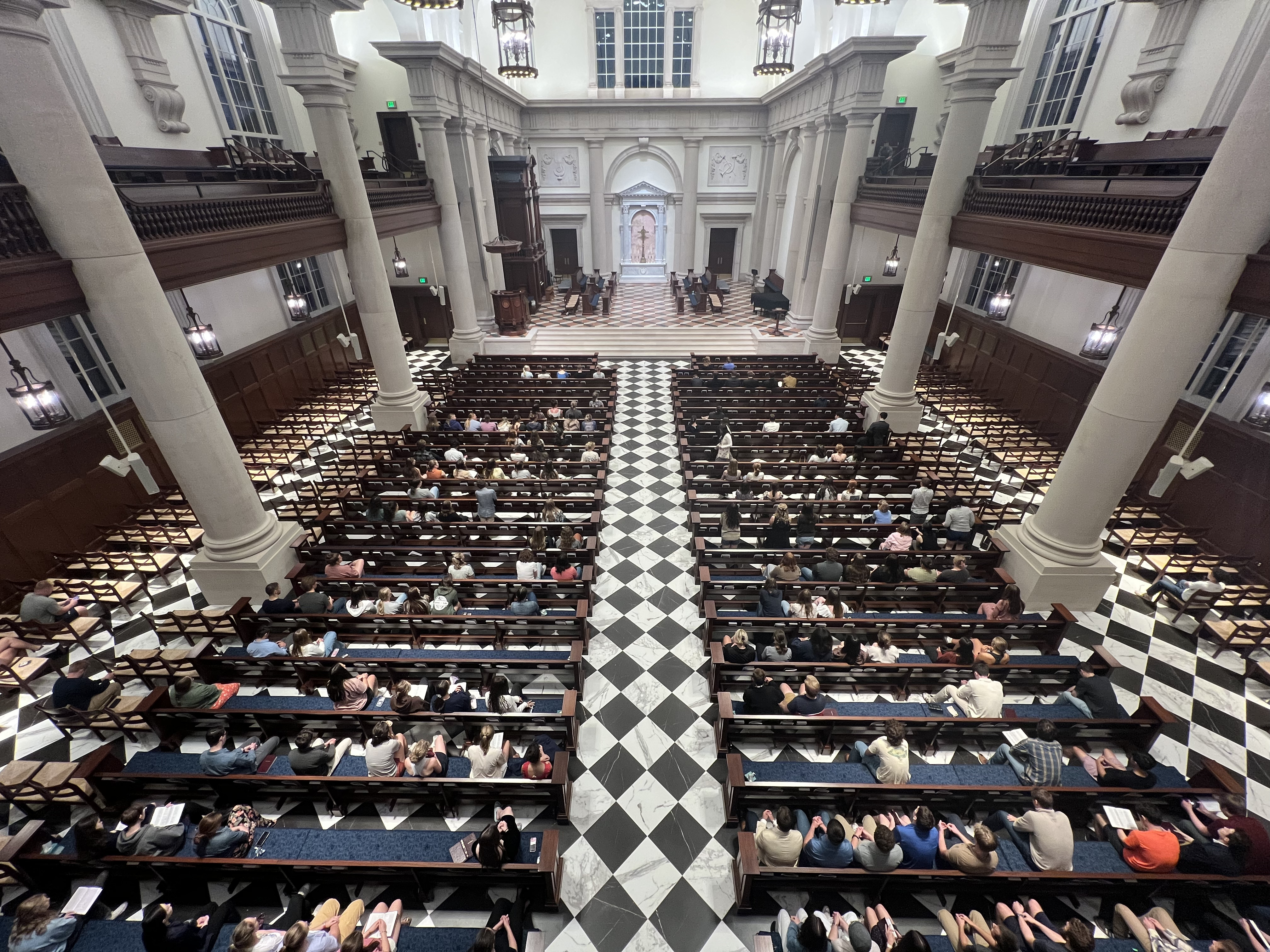 Students fill the pews for the on-campus vigil for Charlie Kirk at Hillsdale College. 