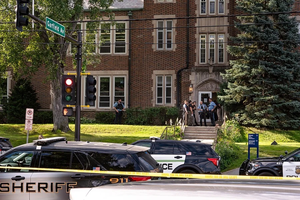 Police gather at Annunciation Catholic School in Minneapolis on Aug. 27, 2025, following a mass shooting that killed two children and injured 17 others, 14 of them children.