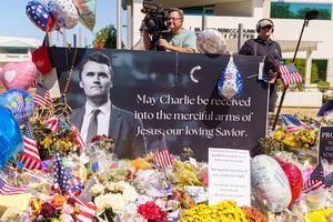 Flowers, handwritten notes and other mementoes lie at a makeshift memorial outside Turning Point USA headquarters in Phoenix, Arizona, on Sept. 13.