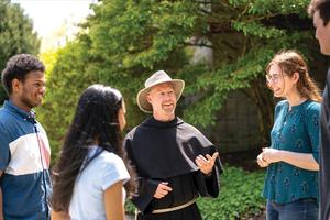 Franciscan Father Jonathan McElhone chats with students at Franciscan University of Steubenville.