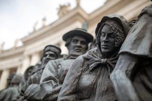 The "Angels Unawares" bronze sculpture by Timothy Schmalz is displayed in St. Peter’s Square on June 29, 2024.