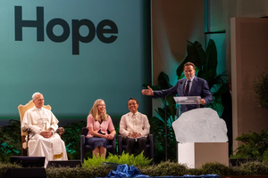 Pope Leo XIV and actor and former California governor Arnold Schwarzenegger address the opening day of the “Raising Hope for Climate Justice” conference held at a center near the papal villa of Castel Gandolfo on Oct. 1, 2025.
