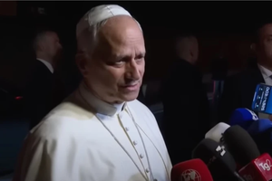 Pope Leo XIV answers questions during an impromptu Q&A with journalists outside Castel Gandolfo on Sept. 30, 2025. 