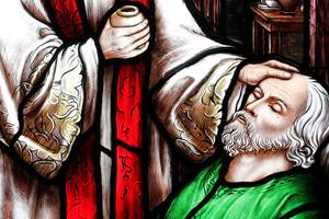 A stained-glass window at Song Vinh Church in Vietnam depicts the sacrament of the Anointing of the Sick