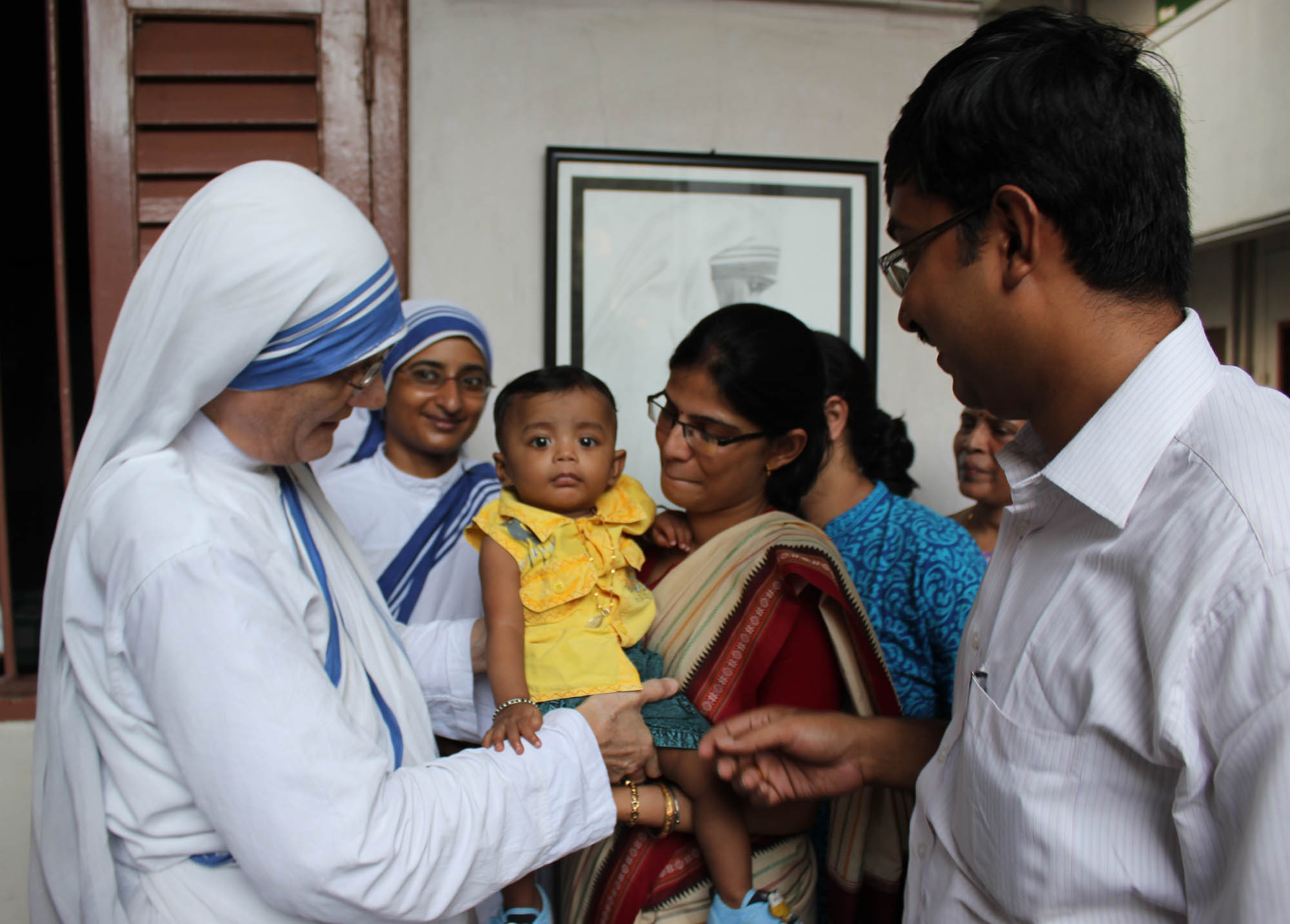 MC suprerior general Sr Prema- gives an orphan child in adoption to a Hindu couple in 2013 at the Mother House in Kolkata
