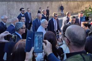 Pope Leo XIV answers questions from the media outside Castel Gandolfo in Italy on Oct. 7, 2025.