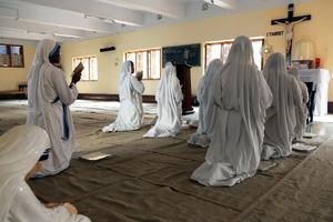 Mother Teresa’s Missionaries of Charity kneel before the Blessed Sacrament at the Mother House in Kolkata, India, where daily prayer sustains their service to the poorest of the poor.