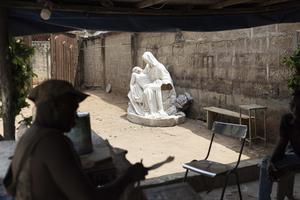 A copy of Michelangelo’s Pietà is seen at the workshop of Anthony Agasi in Onitsha, Nigeria, on Feb. 28, 2023. Some sculptures can take up to a month to finish, selling both to churches and individuals.