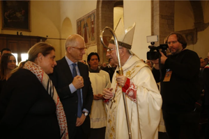 Cardinal Pietro Parolin greets the parents of St. Carlo Acutis, Antonia and Andrea Acutis, before Mass at the Church of Santa Maria Maggiore in Assisi, Italy, on Oct. 12, 2025. 