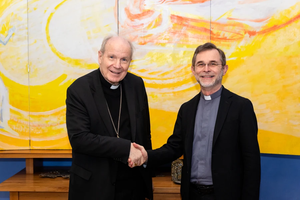 Cardinal Christoph Schönborn (left) shakes hands with now Archbishop-elect of Vienna Josef Grünwidl at the time of his appointment as apostolic administrator of the Archdiocese of Vienna on Jan. 22, 2025, and on Oct. 17, 2025.