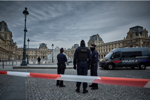 French Police officers seal off the entrance to the Louvre Museum after a jewelry heist on Oct. 19, 2025, in Paris. 