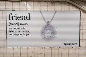 An advertising campaign for the ‘Friend’ artificial intelligence device is seen inside the West 4th Street subway station in West Village, Manhattan, Sept. 29, 2025. The ads have been defaced with several messages rejecting the use of artificial intelligence. The one above says: ‘Human connection is sacred,’ and ‘friend’ is crossed out on the ad. 