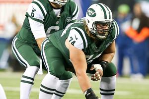 New York Jets quarterback Mark Sanchez (6) takes the snap from center Nick Mangold (74) against the New England Patriots at MetLife Stadium on Nov. 22, 2012.
