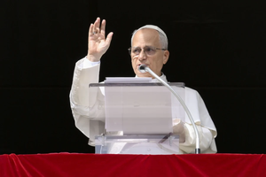 Pope Leo XIV waves to pilgrims gathered in St. Peter’s Square for his Sunday Angelus on Oct. 26, 2025, at the Vatican.
