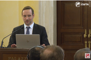 Tristan Azbej speaks to a conference in Rome about the work of Hungary Helps, November 2023.