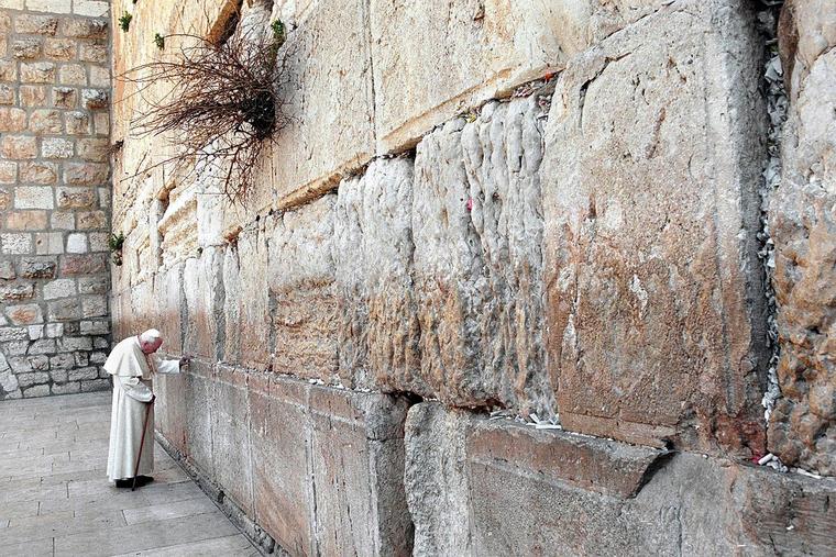 Pope St. John Paul II stands in prayer at the Wailing Wall on March 26, 2000, in Jerusalem.