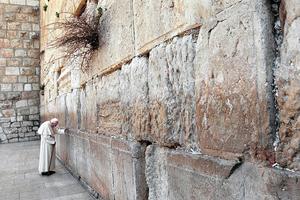 Pope St. John Paul II stands in prayer at the Wailing Wall on March 26, 2000, in Jerusalem.