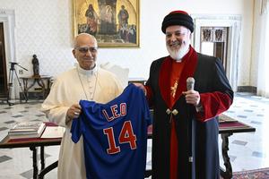 Mar Awa III presents a Chicago Cubs jersey to Pope Leo XIV on Oct. 27, 2025. 