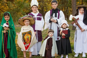 Kids dress up as their favorite saint. 