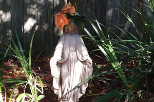The author’s statue of Mary in her home garden