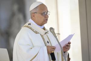 Pope Leo XIV reads his homily at Mass in St. Peter's Square at the Vatican on Nov. 1, 2025. 