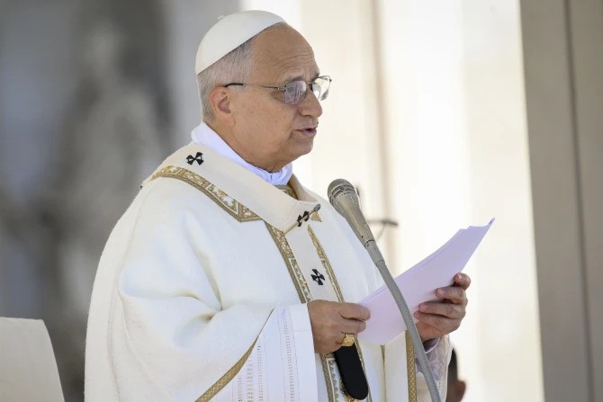 Pope Leo XIV reads his homily at Mass in St. Peter's Square at the Vatican on Nov. 1, 2025. 