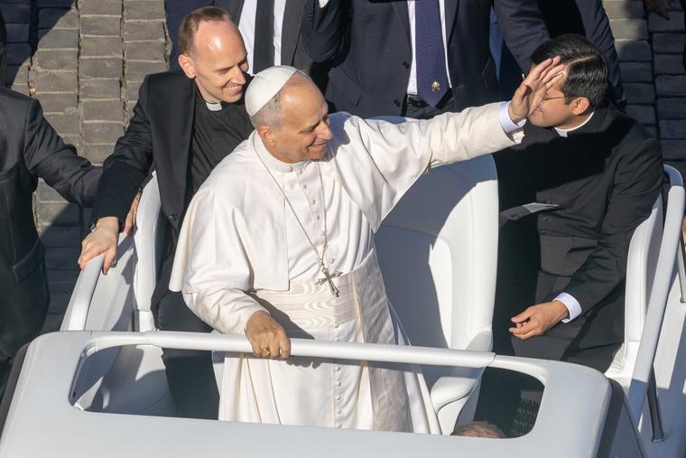 Pope Leo XIV greets the faithful from his popemobile after Mass and proclamation of Saint John Henry Newman as 'Doctor of the Church.'