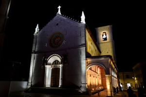 The outside of the reconstructed Basilica of St. Benedict in Norcia, Italy, is lit up with lights in celebration of its reopening on Oct. 30, 2025.