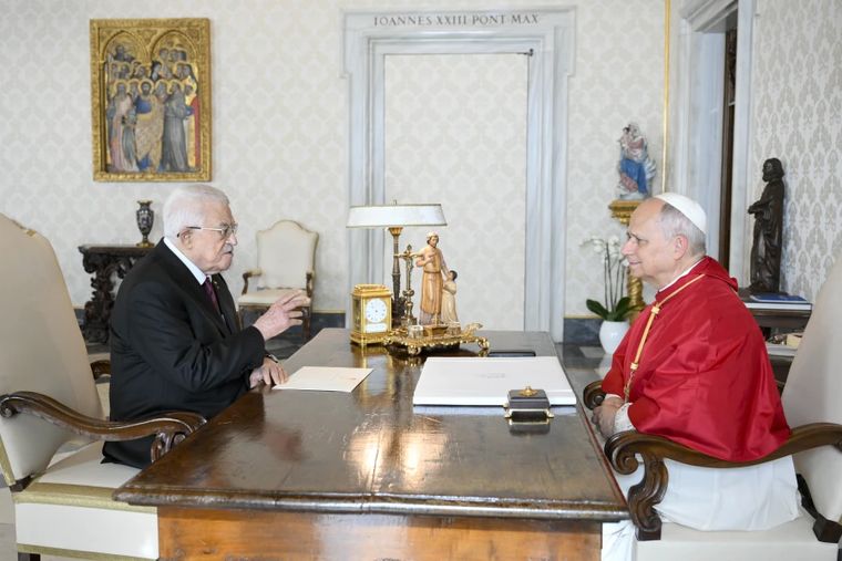 Pope Leo XIV speaks with President Mahmoud Abbas of Palestine during a private audience in the Vatican’s Apostolic Palace on Nov. 6, 2025.