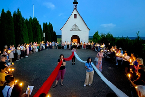 Women of the military council attend an outdoor Rosary ceremony where the Rosary is said in every language group spoken by the participants, typically six different languages. The ceremony took place during the European Regional Retreat in 2024 in Schoenstatt, Germany. 