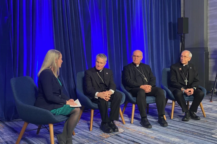 Maura Moser (far left), director of the Catholic Communications Campaign, moderates a discussion on immigration with (left to right) Archbishop Timothy Broglio, outgoing president of the U.S. Conference of Catholic Bishops; Bishop Kevin Rhoades, chair of the USCCB’s religious liberty committee, and Bishop Mark Seitz, chairman of the USCCB’s migration committee, on Nov. 11, 2025, during a press conference at the conference’s Fall Plenary Assembly in Baltimore.