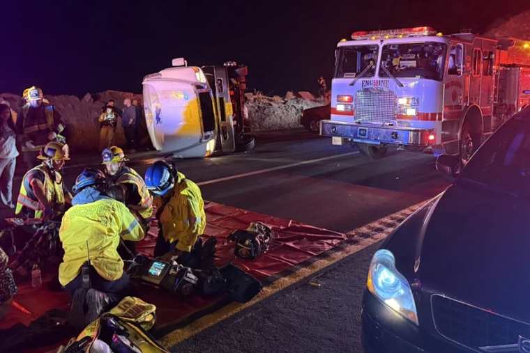 First responders provide aid after a bus carrying a group of mostly teenagers from Our Lady of Guadalupe Catholic Church in Santa Ana, California, on its way home from a three-day retreat at Camp Nawakwa in the San Bernardino Mountains crashed on a two-lane highway near Running Springs on Nov. 9, 2025.