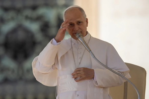 Pope Leo XIV gives his apostolic blessing at the end of the general audience in St. Peter’s Square on Nov. 12, 2025.
