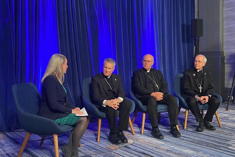 Maura Moser (far left), director of the Catholic Communications Campaign, moderates a discussion on immigration with (left to right) Archbishop Timothy Broglio, outgoing president of the U.S. Conference of Catholic Bishops; Bishop Kevin Rhoades, chair of the USCCB’s religious liberty committee, and Bishop Mark Seitz, chairman of the USCCB’s migration committee, on Nov. 11, 2025, during a press conference at the conference’s Fall Plenary Assembly in Baltimore. 