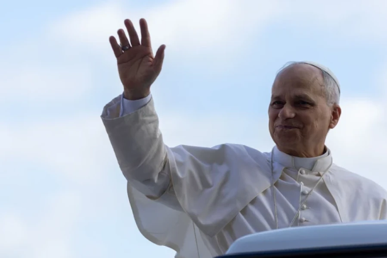 Pope Leo XIV waves to the crowd at the Vatican general audience on Oct. 25, 2025.