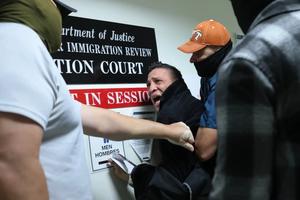 A man seeking asylum from Colombia is detained by federal agents as he attends his court hearing in immigration court at the Jacob K. Javitz Federal Building on Oct. 27, 2025, in New York City.