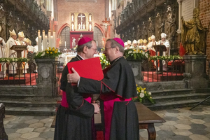 Archbishop Tadeusz Wojda of Gniezno, president of the Polish Bishops’ Conference (left), and Bishop Georg Bätzing, president of the German Bishops’ Conference, embrace after signing the joint declaration “Courage of Extended Hands” at the Cathedral of St. John the Baptist in Wrocław, Poland, on Tuesday, Nov. 18, 2025, during commemorations of the 60th anniversary of the historic correspondence between the Polish and German Bishops’ Conferences.