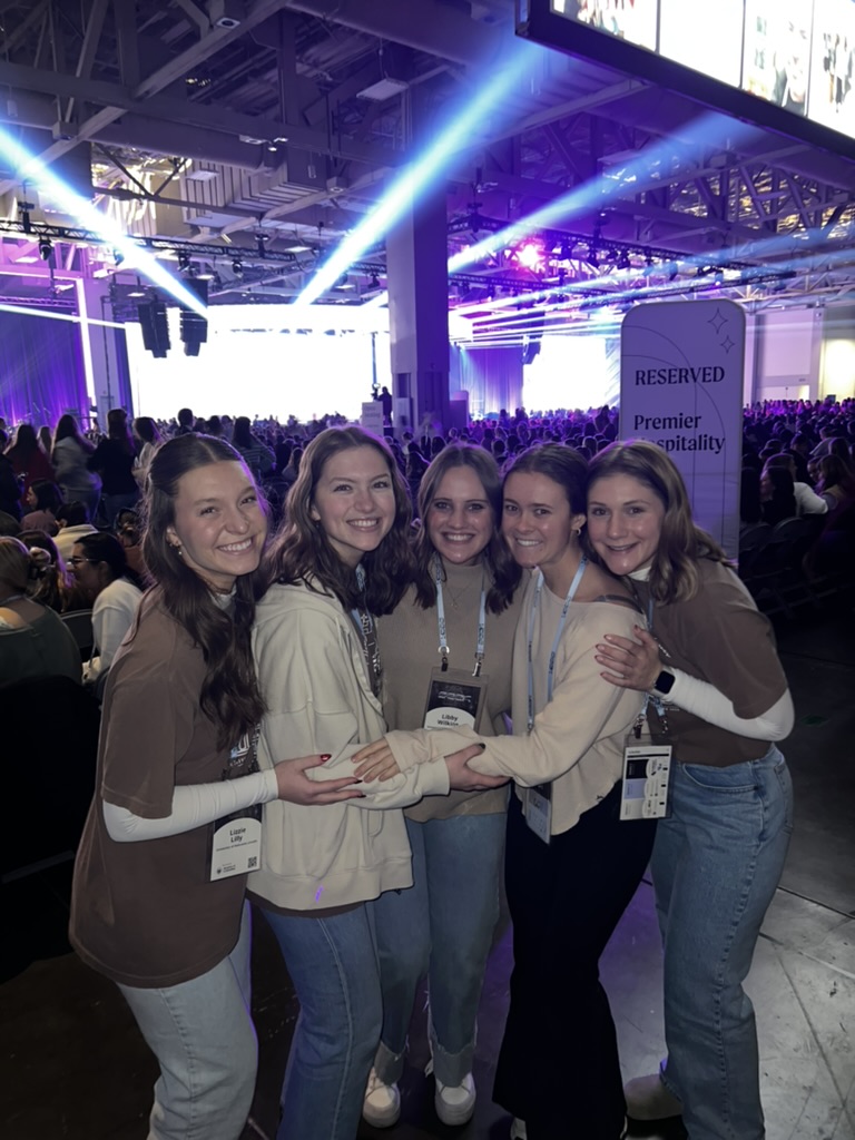 Libby Wilkins, center, with her friends at the SEEK Catholic conference in St. Louis