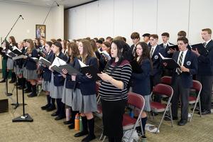 Choir members rehearse the new hymn honoring Our Lady of Champion, composed for and debuted at the Wisconsin shrine on Oct. 9 during the inaugural solemnity.