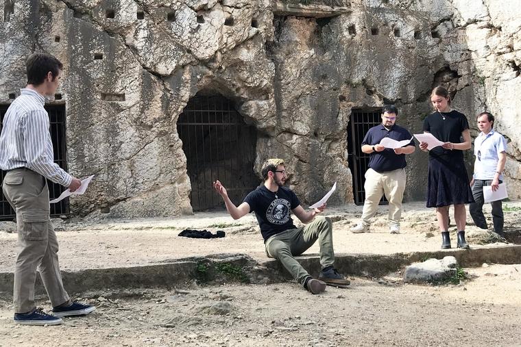 On a 2023 school trip to Athens, philosophy students from the University of Dallas re-enact the death of Socrates at the traditional site of his prison.