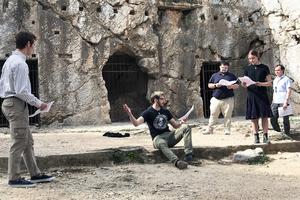 On a 2023 school trip to Athens, philosophy students from the University of Dallas re-enact the death of Socrates at the traditional site of his prison.