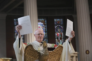 Archbishop Dermot Farrell of the Dublin Archdiocese holds up the decree on Nov. 14, 2025, that Pope Leo XIV sent him granting his request that St. Mary’s Pro Cathedral of the Archdiocese of Dublin be designated as the cathedral Church of the archdiocese.
