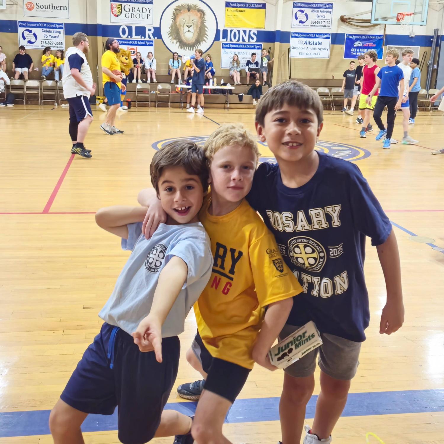 Kids strike a pose in the gym at Our Lady of the Rosary Catholic School. 