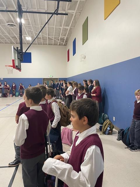 Kids in the gym inside Sacred Heart Hybrid Academy. 
